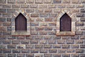 free castle windows in stone brick wall background photo