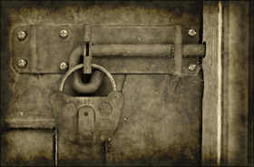 Old vintage grungy lock on a door photo