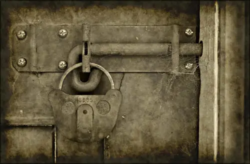 free old grungy lock on door background photo
