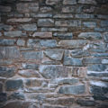 an old dirty and grungy stone wall background texture