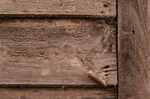 background texture of a rough old brown wood wall