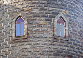 two windows in the castle wall background