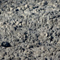 rocks at the seaside that look like a desolate moonscape