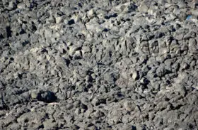 rocks at the seaside that look like a desolate moonscape