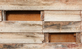 Old wood wall with missing planks free background