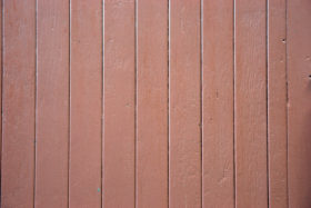 red-ish wooden paneled fence background texture