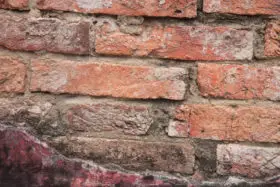some rough old bricks in a wall background