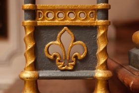 closeup image of an iron fleur-de-lis