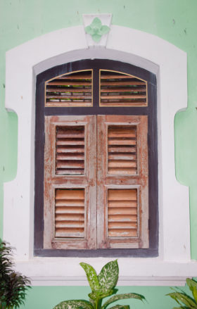 shuttered window in wall background