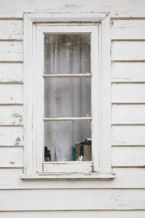 white wooden wall with window