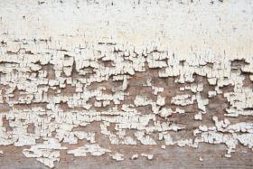 Three closeups of peeling paint on wooden wall textures