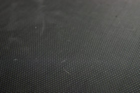 black plastic trampoline mesh background aka carbon fiber texture