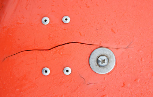 orange plastic with screw and rivets
