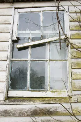 old broken window in wall