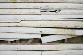 old white weatherboard wooden plank wall