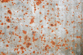 old metal background texture with red rust spots