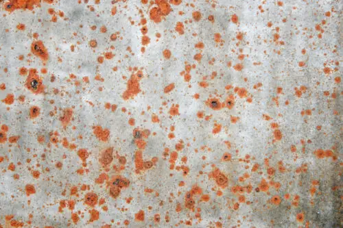 old metal background texture with red rust spots