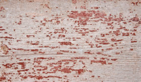 old faded red painted wood background texture