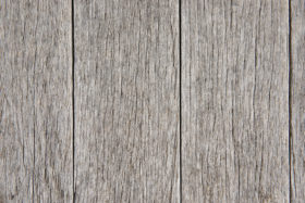 closeup photo of some old rough wooden floor boards background texture