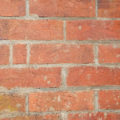 closeup photo of an old red brick wall free background texture