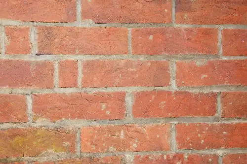 closeup photo of an old red brick wall free background texture