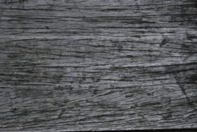 dark grunge background of an old wooden texture