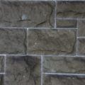 closeup of an old stone brick wall background texture