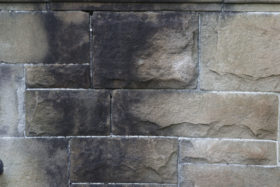 A grungy stone brick wall background