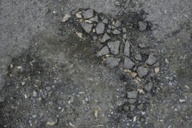 another rough stony bitumen road background texture