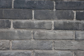 A dark brick wall background texture