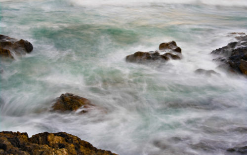 great image of soft ocean waves on rocks