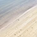 water on the edge of the beach