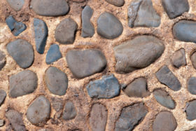 closeup image of a cement and stone wall or path background