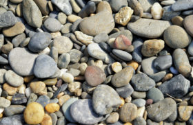 Free beach pebbles or stones background texture image