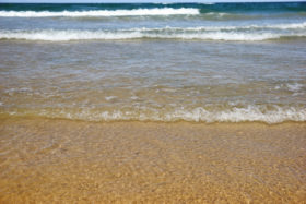 Another beach scene and sea on the sand water background image