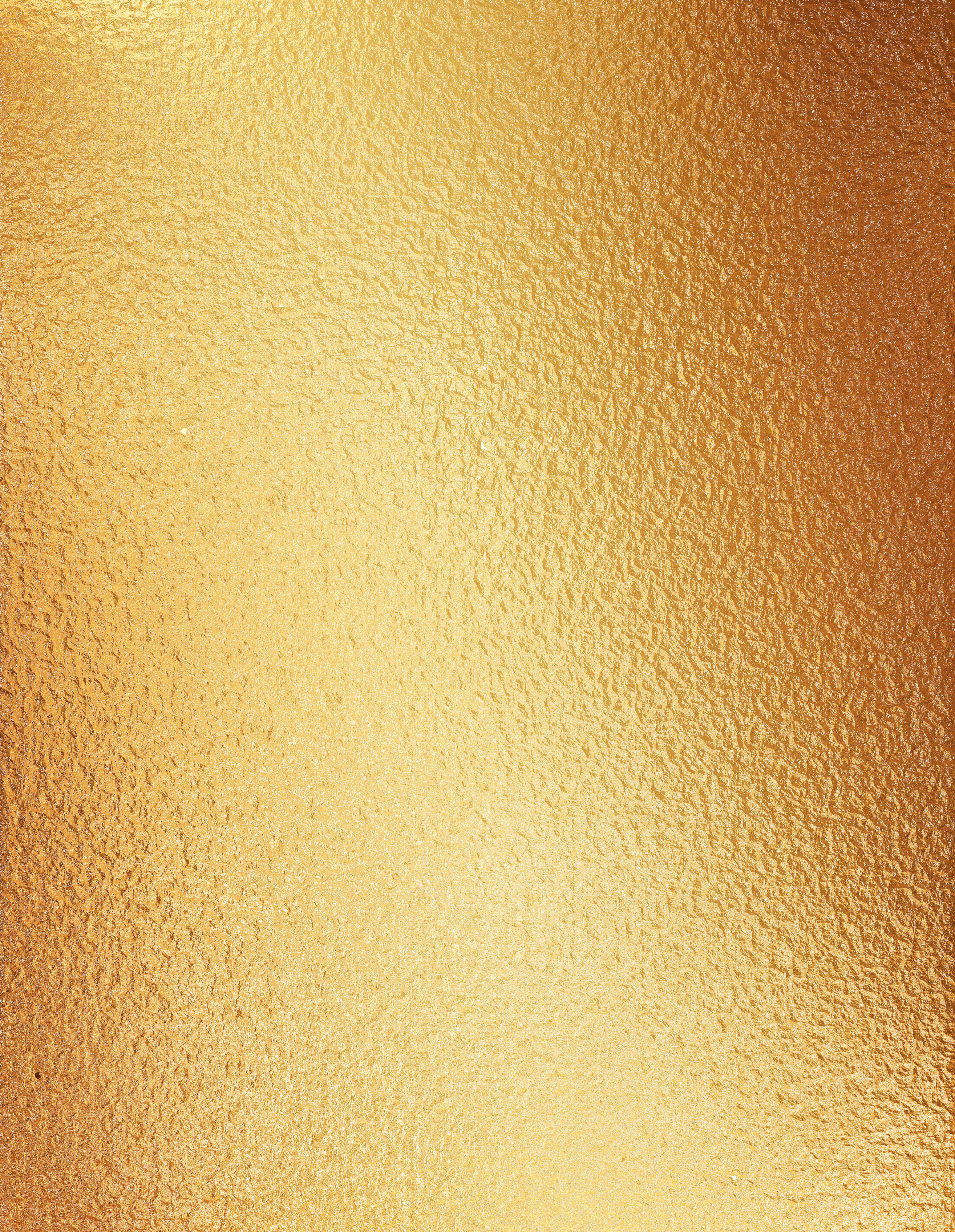 Gold background of a sheet of finely crinkled metal foil