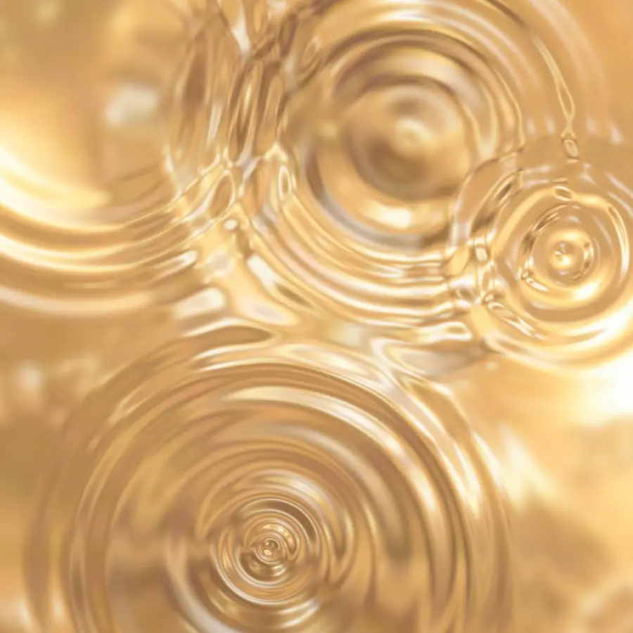 seamless background of ripples in gold metal texture