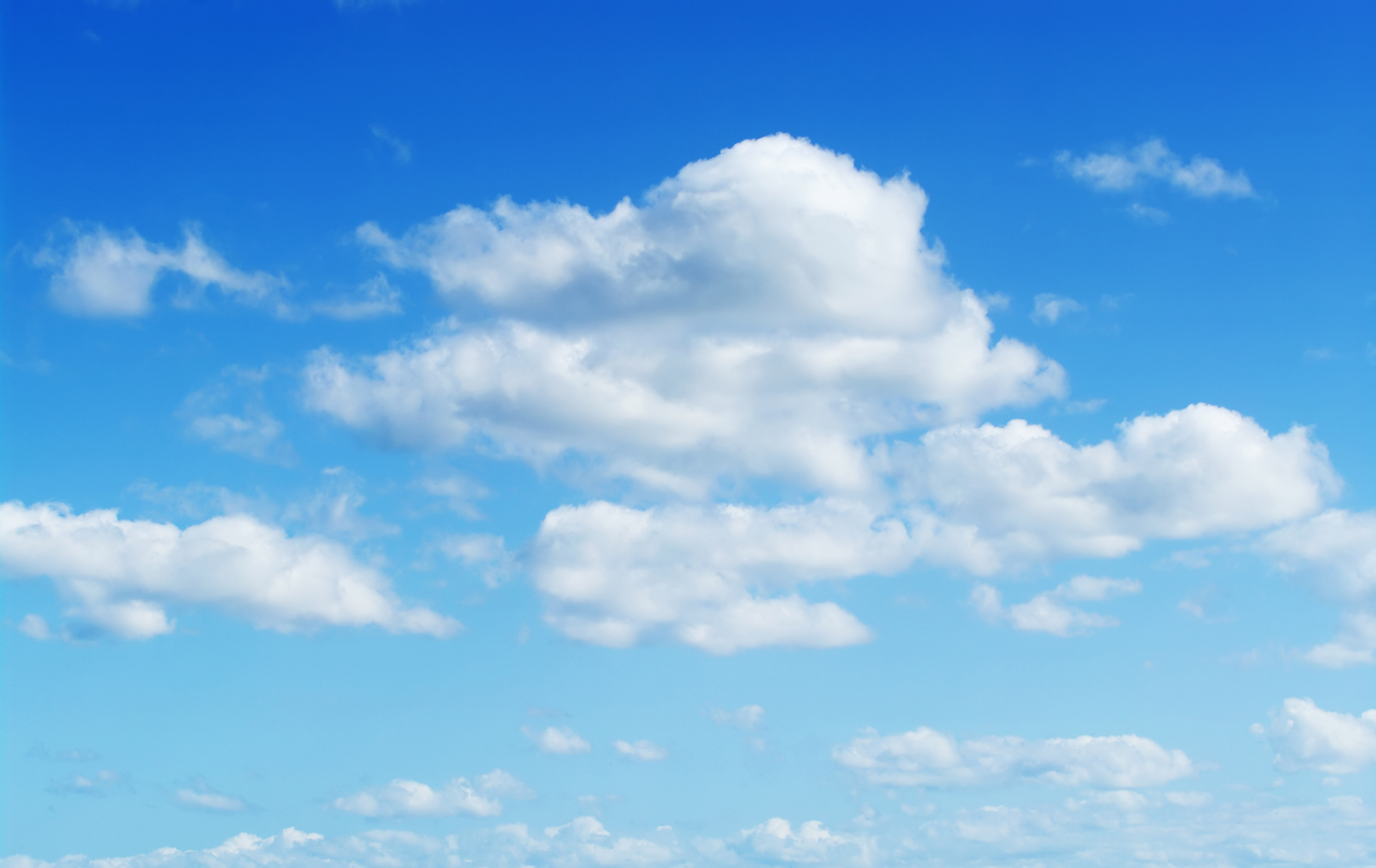 Fluffy cloud texture from a perfect cloudy blue sky