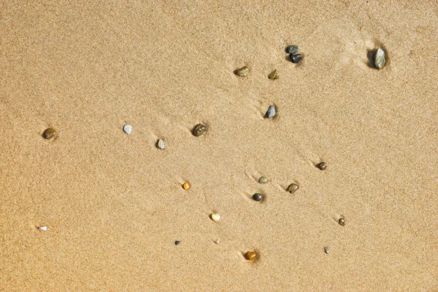 Three photos of small stones and beach sand