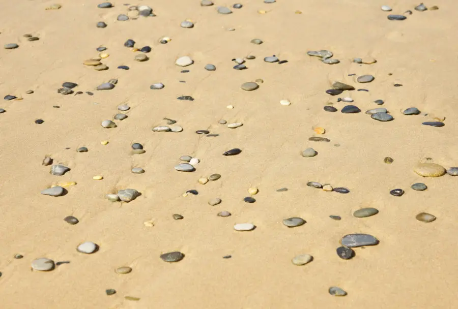 Pebble stones on the beach - two free background images