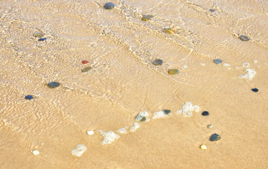 Water, stones, rocks and sand background image