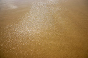 Two free photos of sunlight on the water at the beach