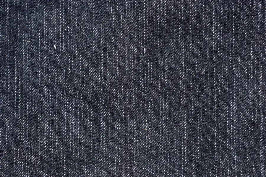 Straight and simple, a black denim background, cloth jeans fabric texture