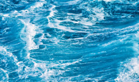 Blue background photo of some ocean waves