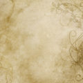 faded and worn floral design on old paper or parchment texture