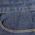 front pocket with studs of blue denim fabric