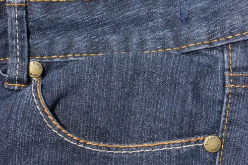 front pocket with studs of blue denim fabric