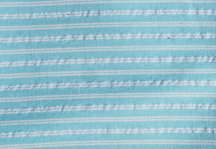 free texture from a light blue striped fabric textile material