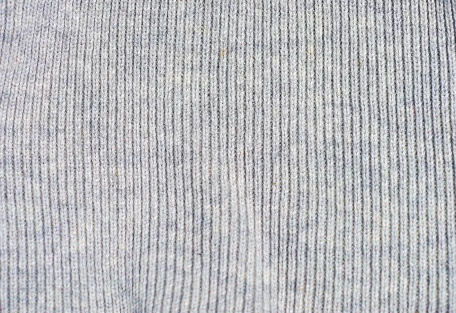 Two grey backgrounds of knit wool fabric textures