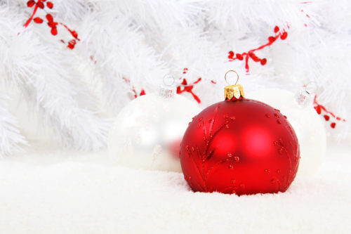 red christmas ball or bauble decoration on white background